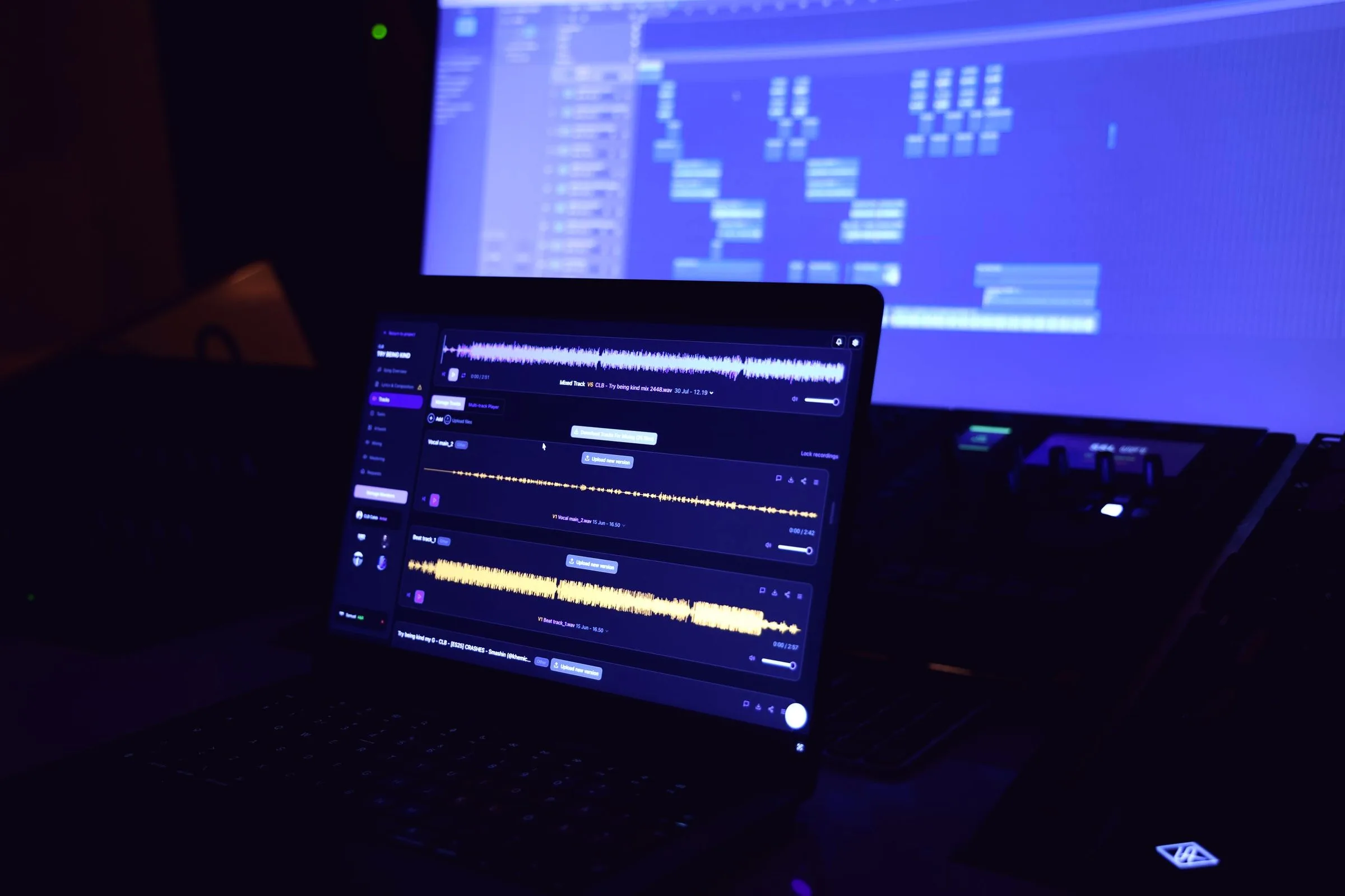 TrackSpace open on a laptop in a dark studio